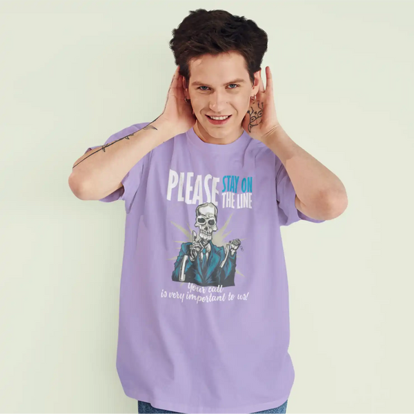 A male model wearing an iris lavender Sapienwear men's t-shirts with the "your call is important" graphic on the front side