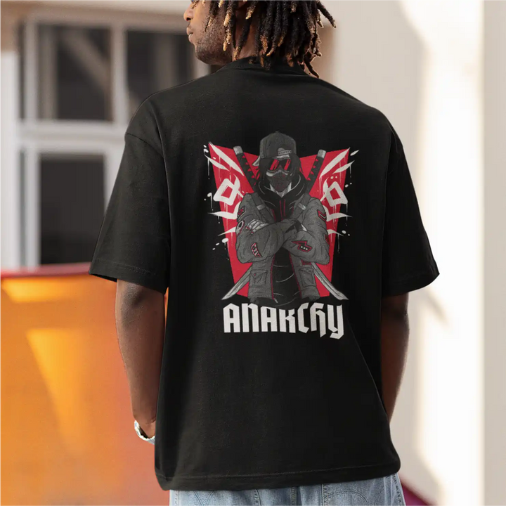 a model wearing Sapienwear's black men's oversized t-shirt with the anarchy graphic on the back side.