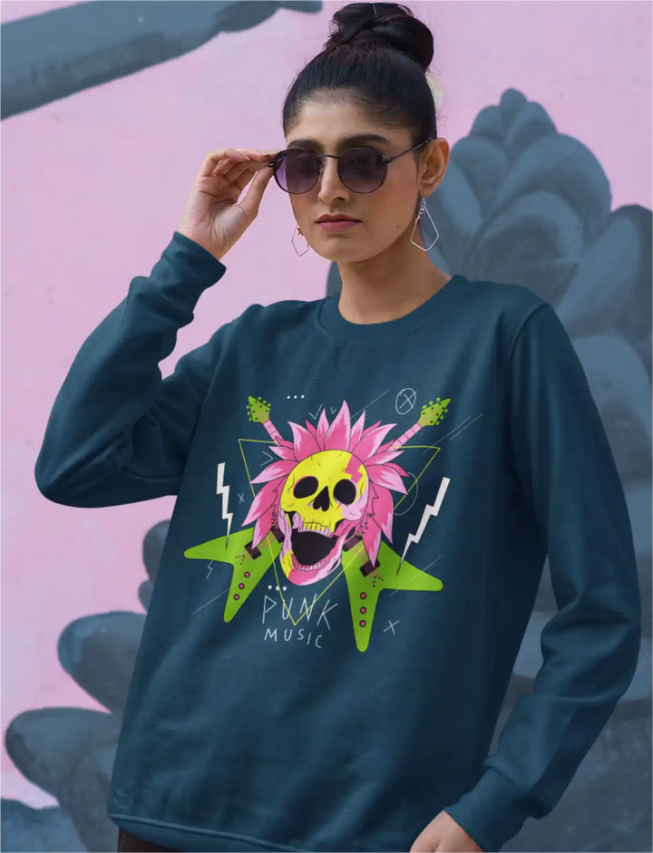 a female model wearing a navy blue sapienwear women's sweatshirt with the punk music graphic on the front side