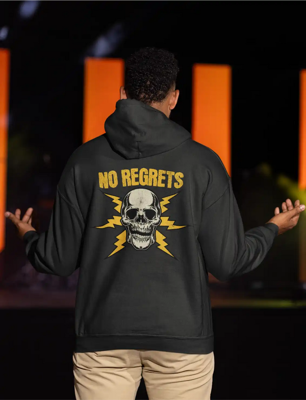 a male model wearing a black men's hoodie with the no regrets skull graphic on the back side.